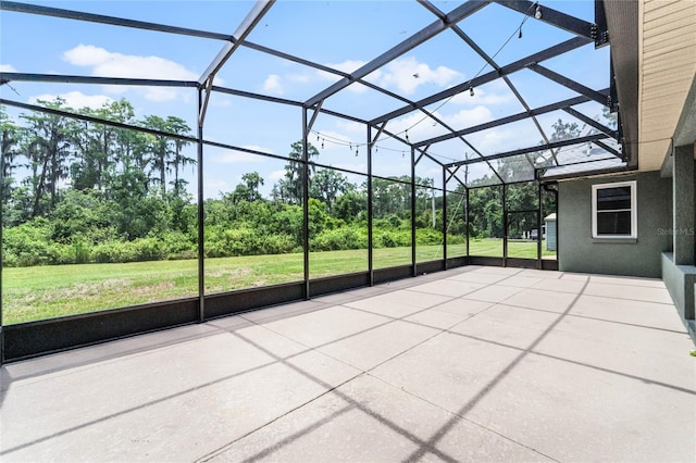 view of patio with a lanai