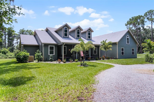 cape cod-style house with central AC and a front lawn