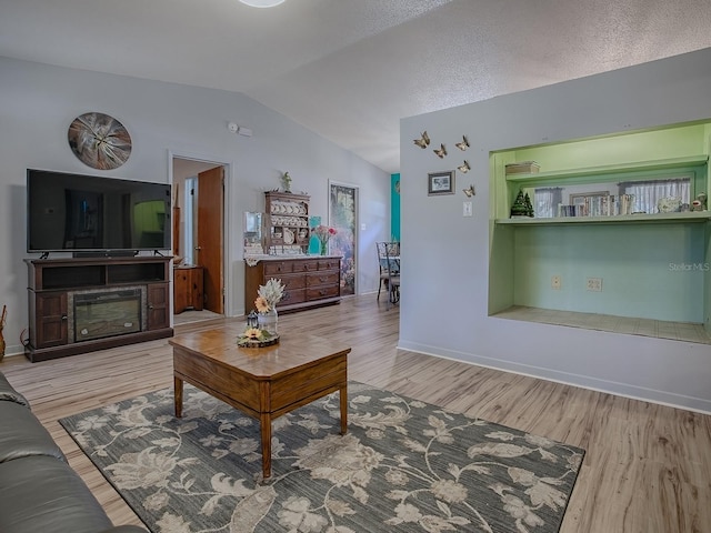 11915 Crk 680, Webster, FL 33597 - living room with vaulted ceiling and light wood-type flooring