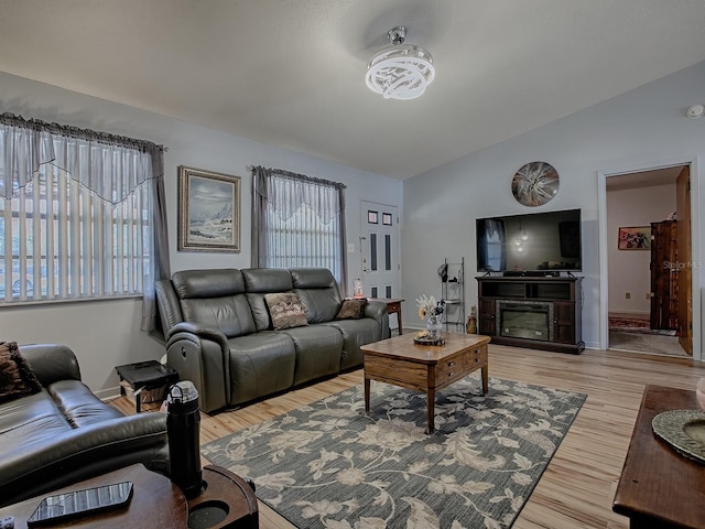 11915 Crk 680, Webster, FL 33597 - living room featuring light hardwood / wood-style flooring and vaulted ceiling