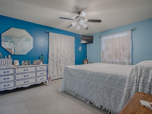 11915 Crk 680, Webster, FL 33597 - bedroom with ceiling fan, carpet floors, and a textured ceiling