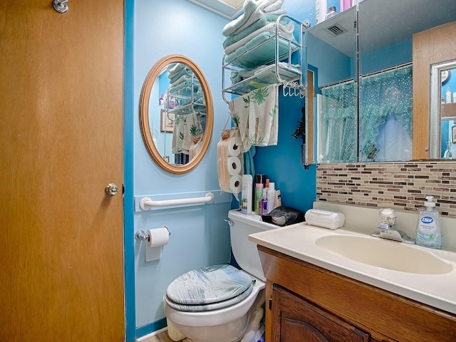11915 Crk 680, Webster, FL 33597 - bathroom featuring vanity, toilet, and decorative backsplash