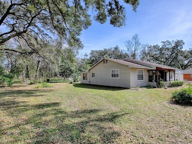 11915 Crk 680, Webster, FL 33597 - view of side of home with a yard