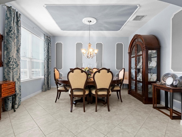887 Daisy Hill Ct, Apopka, FL 32712 - dining room with an inviting chandelier, a raised ceiling, and light tile patterned flooring