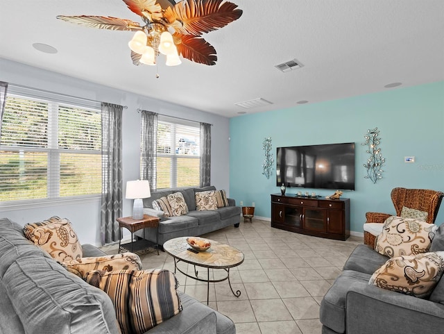 887 Daisy Hill Ct, Apopka, FL 32712 - tiled living room with a textured ceiling and ceiling fan