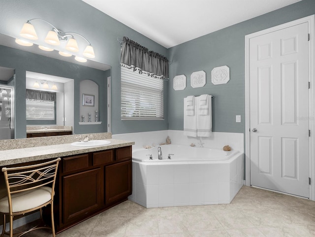 887 Daisy Hill Ct, Apopka, FL 32712 - bathroom featuring tile patterned flooring, vanity, and tiled bath