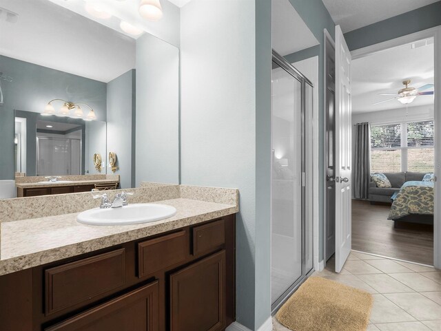 887 Daisy Hill Ct, Apopka, FL 32712 - bathroom featuring vanity, tile patterned floors, ceiling fan, and walk in shower