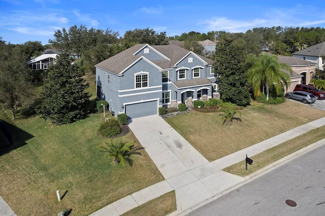 887 Daisy Hill Ct, Apopka, FL 32712 - view of front of house featuring a garage and a front yard
