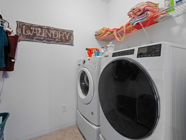 887 Daisy Hill Ct, Apopka, FL 32712 - clothes washing area featuring separate washer and dryer and light tile patterned floors
