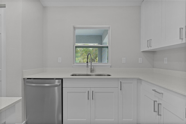 kitchen with white cabinetry, sink, and dishwasher