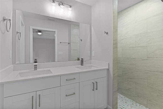 bathroom featuring vanity and a tile shower