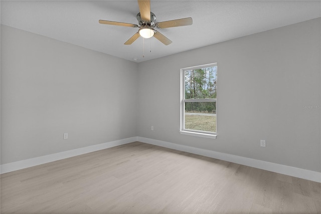 empty room featuring ceiling fan and light hardwood / wood-style flooring