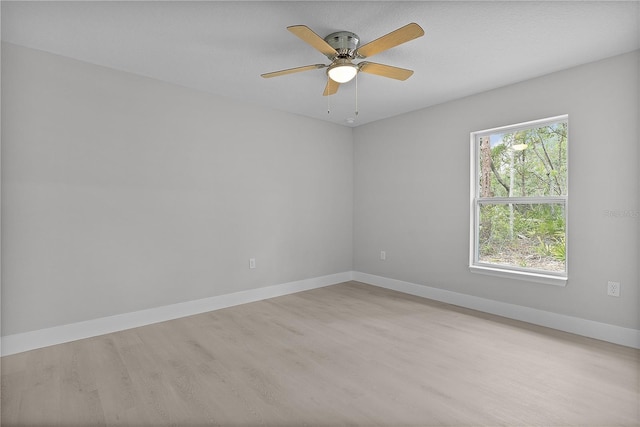 unfurnished room featuring ceiling fan and light hardwood / wood-style flooring