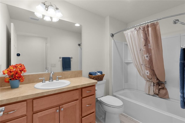 bathroom featuring visible vents, vanity, toilet, and shower / bath combo with shower curtain