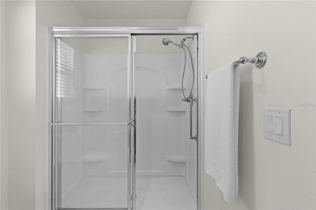 full bathroom featuring a shower stall