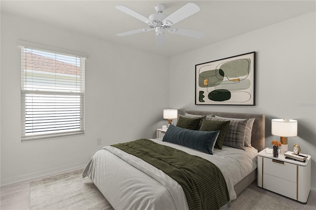 bedroom featuring ceiling fan and baseboards