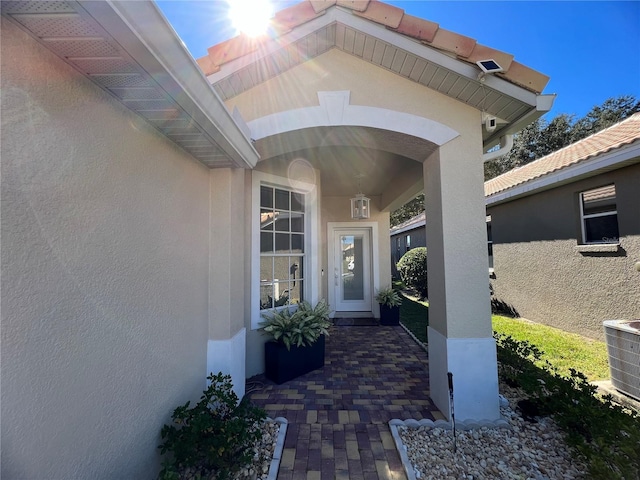 doorway to property with central air condition unit