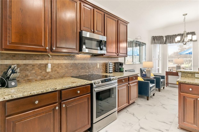 kitchen with decorative backsplash, appliances with stainless steel finishes, light stone counters, marble finish floor, and pendant lighting