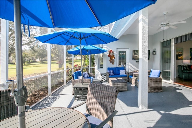 view of patio featuring an outdoor hangout area and a ceiling fan