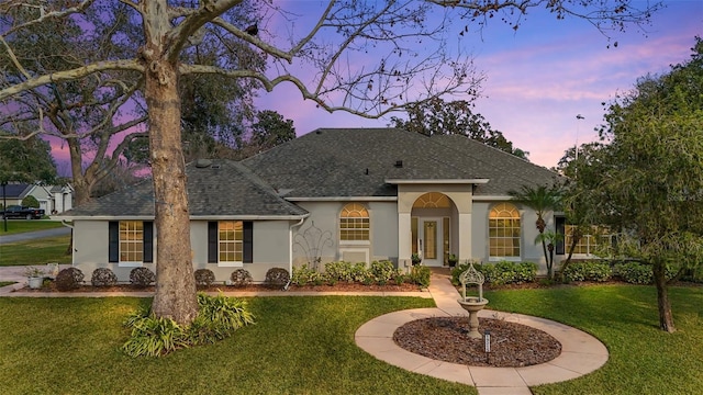 19215 Park Place Blvd, Eustis, FL 32736 - view of front facade featuring a yard