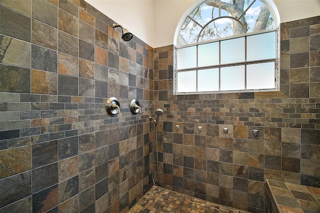 bathroom with a tile shower