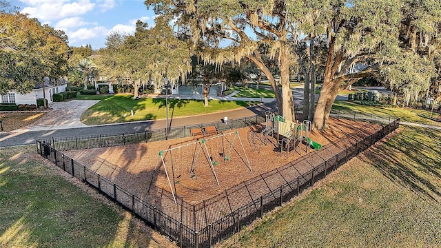 surrounding community with a yard and a playground