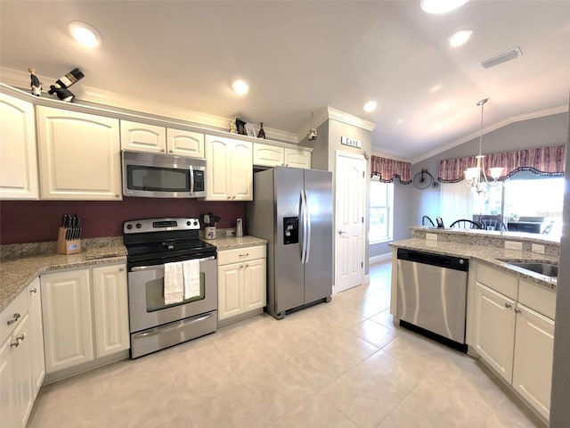 kitchen with vaulted ceiling, decorative light fixtures, a notable chandelier, light stone counters, and stainless steel appliances