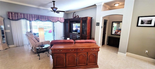 living room with ornamental molding, light tile patterned floors, and ceiling fan