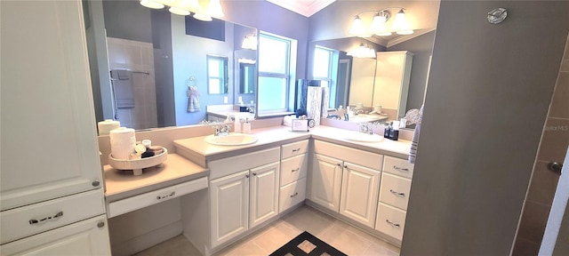 bathroom featuring crown molding, vanity, tile patterned flooring, and walk in shower