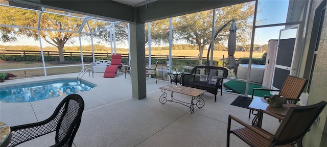 view of pool featuring a patio, a lanai, and a rural view