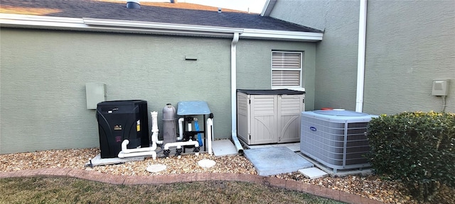 view of side of home with cooling unit