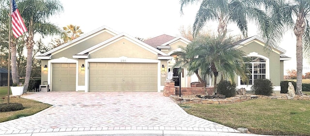 single story home with a garage and a front yard