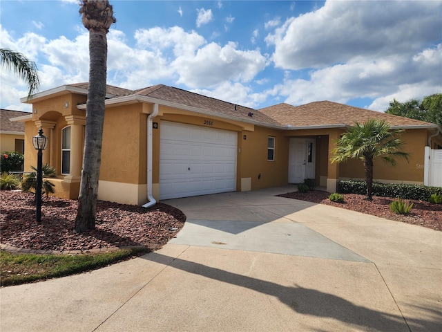 view of front of home with a garage