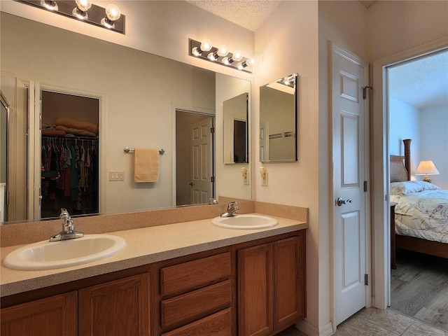 bathroom featuring vanity and a textured ceiling