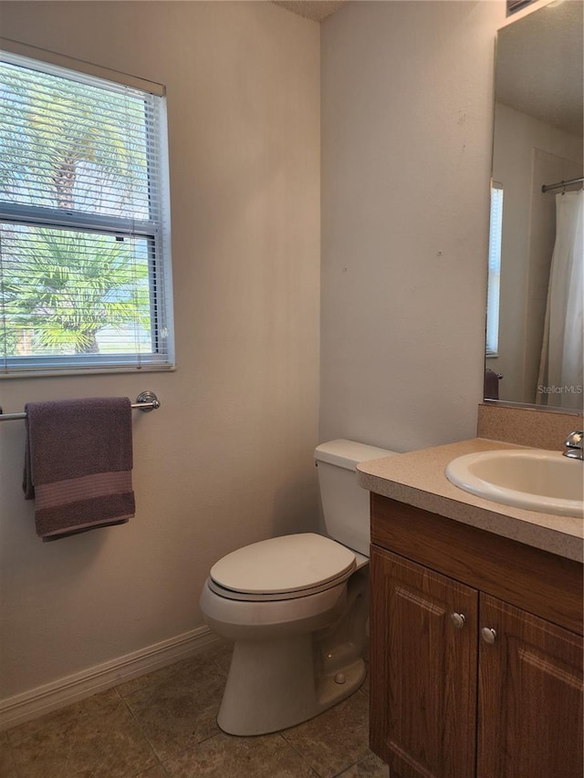 bathroom with vanity, tile patterned flooring, toilet, and a shower with shower curtain