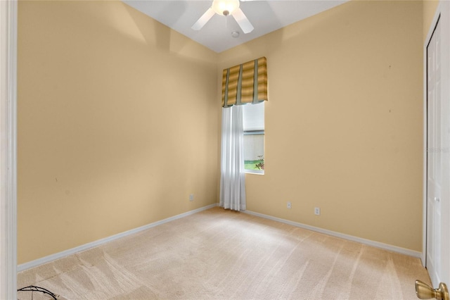 unfurnished room featuring ceiling fan and light colored carpet