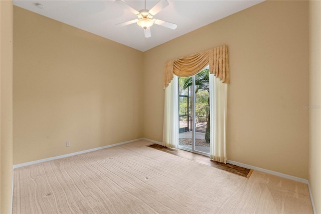 unfurnished room featuring ceiling fan and light colored carpet