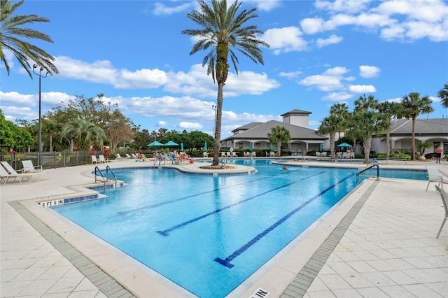 view of swimming pool with a patio