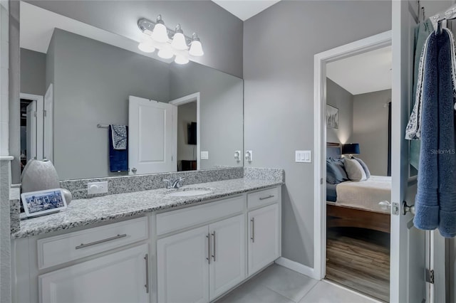 bathroom featuring tile patterned flooring and vanity