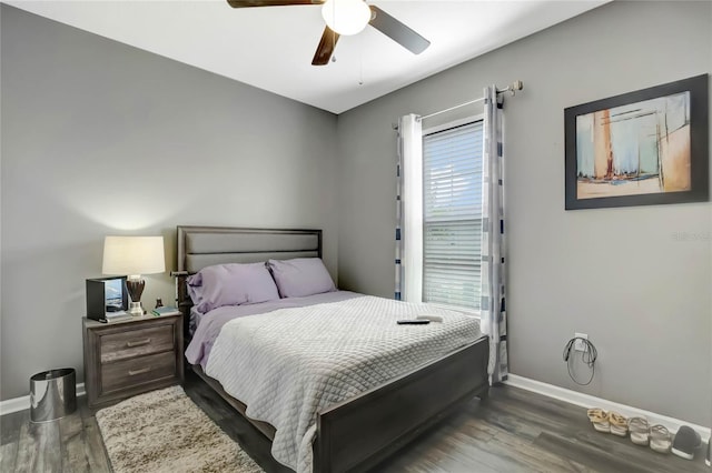 bedroom with dark wood-type flooring and ceiling fan