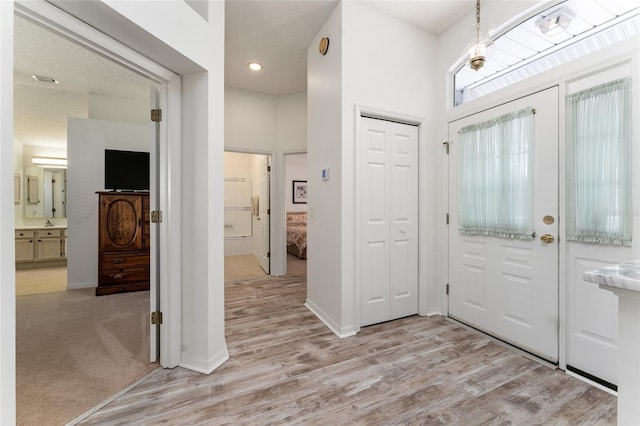 foyer with light wood-type flooring