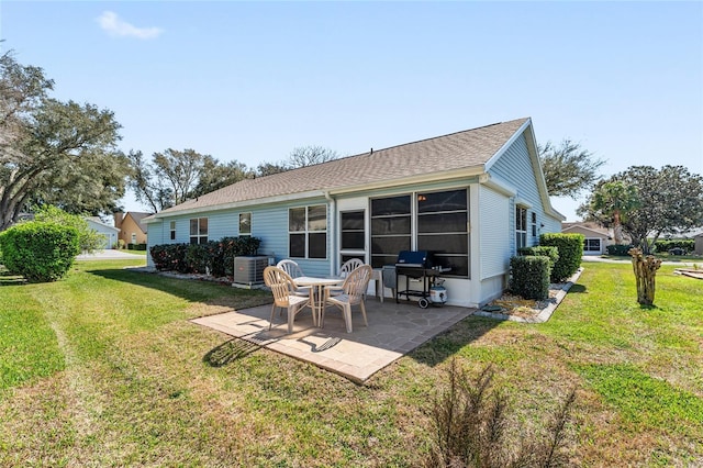 back of house with a yard, central AC, and a patio area