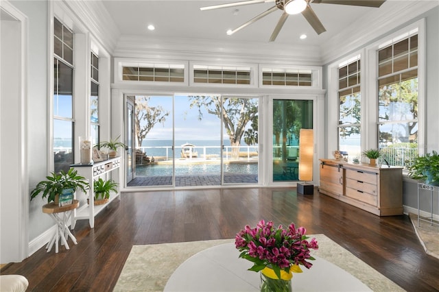 sunroom featuring ceiling fan and a wealth of natural light