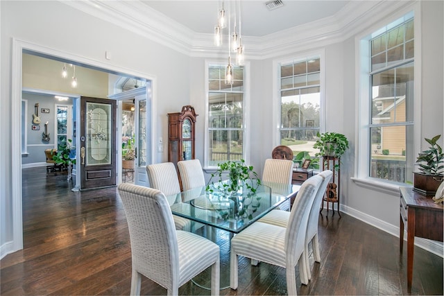 dining room featuring a wealth of natural light, wood-type flooring, and crown molding