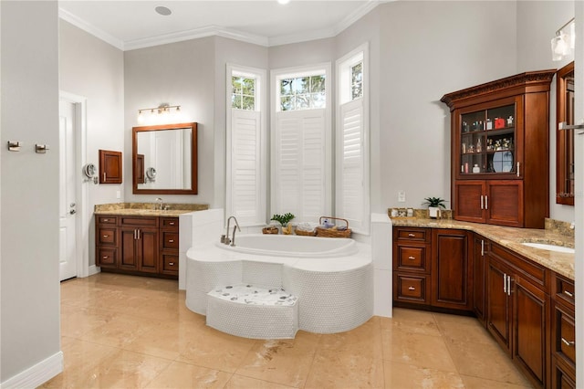 bathroom with a sink, a garden tub, two vanities, and crown molding