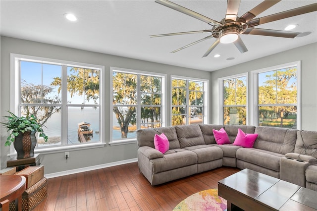 living area featuring dark wood-style floors, plenty of natural light, baseboards, and recessed lighting