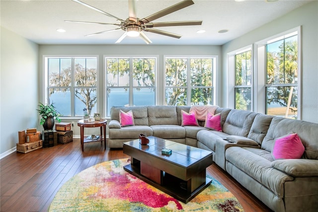 sunroom / solarium featuring ceiling fan