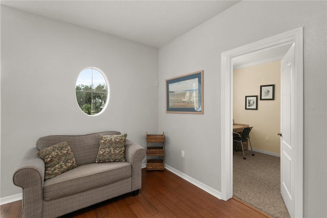 sitting room with wood-type flooring and baseboards