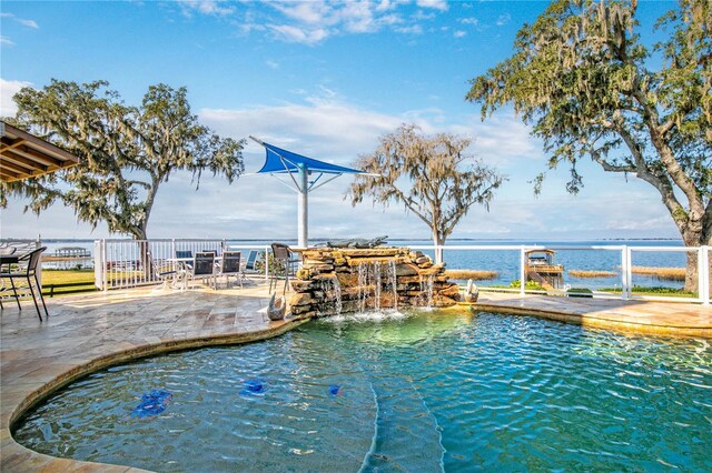 view of swimming pool with a patio