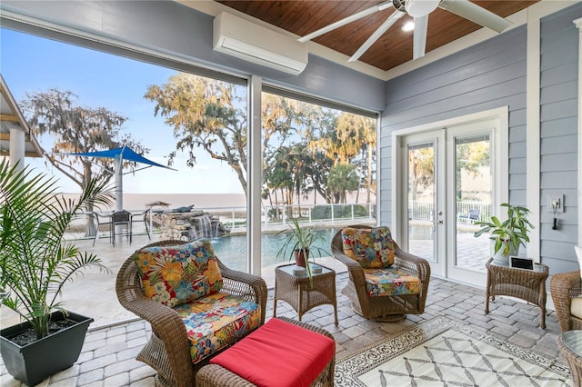 sunroom with wood ceiling, a ceiling fan, french doors, and a wall mounted AC